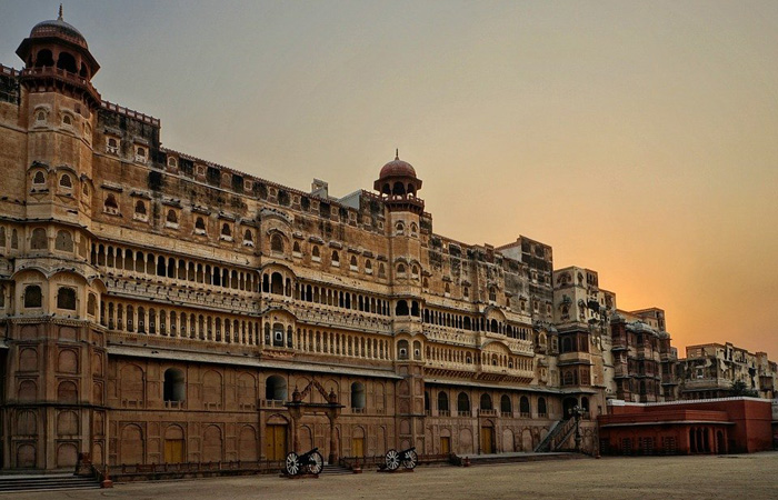 A grand view of the Junagarh Fort in Bikaner, Rajasthan, India, showcasing its intricate Rajput architecture at sunset.