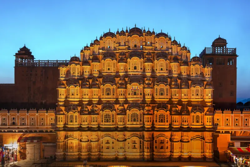 Illuminated Hawa Mahal in Jaipur, an iconic stop on the Luxury Golden Triangle India Group Tour.