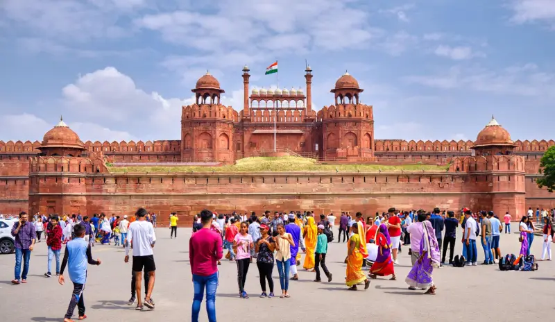 Guests enjoying a group tour at the iconic Red Fort in Delhi, India, as part of the Luxury Golden Triangle Tour experience.